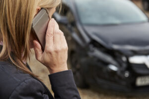Woman Calling To Report Car Accident On Country Road