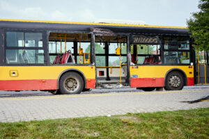 View of devastated city bus after road accident in the city.