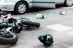 a person suffering bodily injury and head injury. Motorcycle accident caused by someone neglecting traffic laws and roadway rules