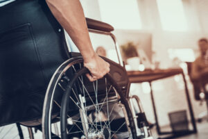 a person in a wheelchair after suffering a product defect injury