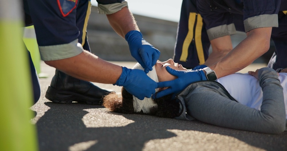 woman on ground with head injuries taking note of accident in preparation to contact Las Vegas personal injury lawyer