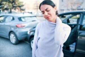 Woman bracing neck after personal injury in Las Vegas, NV